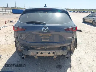 2023 Mazda CX-5 S Carbon Edition z VIN JM3KFBCM7P0164462, wystawiony jako IAAI lot #41919579 z przebiegiem 49 585 mil mil oraz . Historia ofert i sprzedaży dostępna na DreamBid. Obrazek 17.