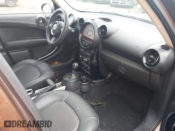 2014 MINI Countryman with VIN WMWZB3C51EWR36737, listed as a IAAI auction lot 41741248 with 69,717 mi miles and . Bid and sale history available at DreamBid. Image 5.