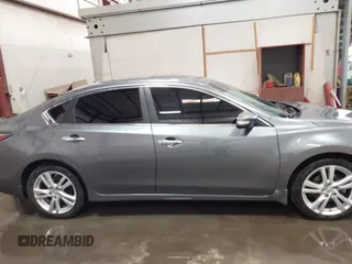 2014 Nissan Altima SL with VIN 1N4BL3AP0EC199270, listed as a IAAI auction lot 42069952 with 94,402 mi miles and . Bid and sale history available at DreamBid. Image 13.