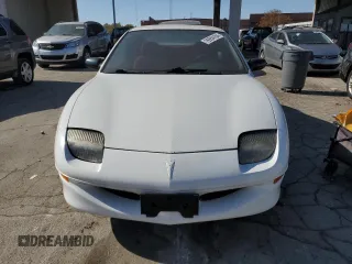 1995 Pontiac Sunfire SE z VIN 1G2JB1244S7508975, wystawiony jako Copart lot #76954164 z przebiegiem 76 187 mil mil oraz Tytuł czysty. Historia ofert i sprzedaży dostępna na DreamBid. Obrazek 5.
