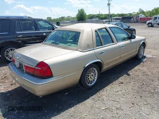2000 Mercury Grand Marquis GS z VIN 2MEFM74W3YX610461, wystawiony jako IAAI lot #42162767 z przebiegiem 181 400 mil mil oraz . Historia ofert i sprzedaży dostępna na DreamBid. Obrazek 4.