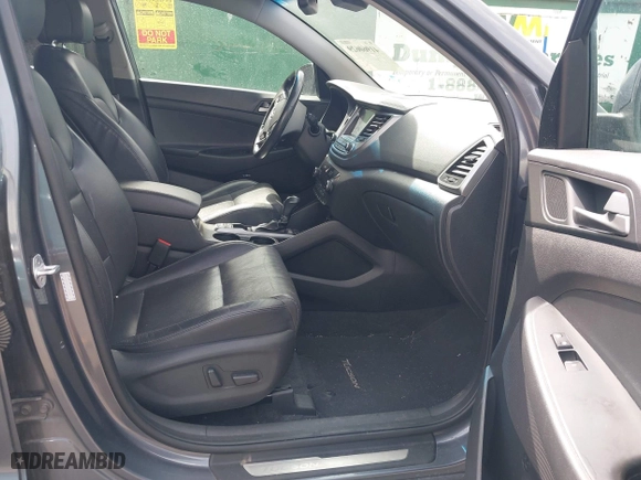 2018 Hyundai Tucson Value with VIN KM8J3CA24JU646807, listed as a IAAI auction lot 41960629 with 117,646 mi miles. Bid and sale history available at carsss.com. Image 5.