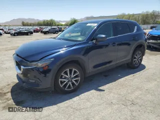2018 Mazda CX-5 Grand Touring z VIN JM3KFADM8J1370173, wystawiony jako Copart lot #61933365 z przebiegiem Nie podano mil oraz Szkoda całkowita • Salvage title. Historia ofert i sprzedaży dostępna na DreamBid. Obrazek 1.