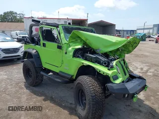 2004 Jeep Wrangler Sahara z VIN 1J4FA59S44P704878, wystawiony jako IAAI lot #42226255 z przebiegiem 88 886 mil mil oraz . Historia ofert i sprzedaży dostępna na DreamBid. Obrazek 1.