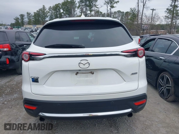 2016 Mazda CX-9 Grand Touring with VIN JM3TCADY0G0113779, listed as a IAAI auction lot 41466750 with 58,035 mi miles and . Bid and sale history available at DreamBid. Image 16.