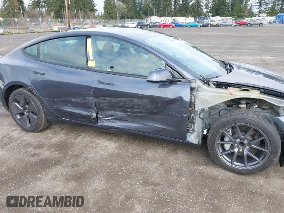 2023 Tesla Model 3 with VIN 5YJ3E1EA2PF623217, listed as a IAAI auction lot 41701413 with 21,246 mi miles and . Bid and sale history available at DreamBid. Image 6.