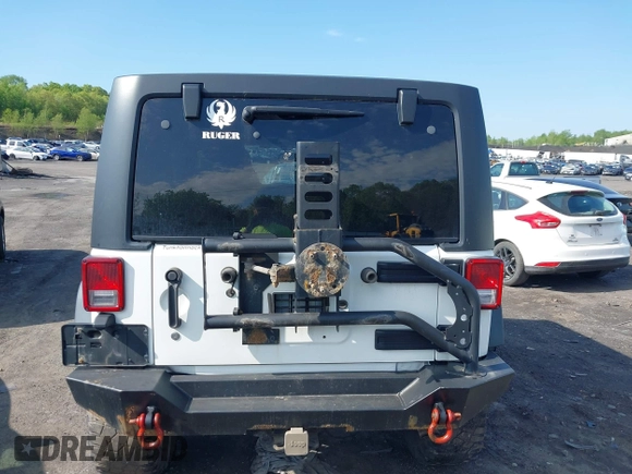 2014 Jeep Wrangler Unlimited Rubicon X with VIN 1C4BJWFG6EL240849, listed as a IAAI auction lot 42216082 with 118,912 mi miles and . Bid and sale history available at DreamBid. Image 16.
