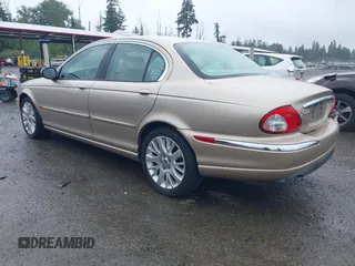 2003 Jaguar X-Type 2.5L Manual z VIN SAJEA51D53XC94089, wystawiony jako IAAI lot #42370566 z przebiegiem 81 687 mil mil oraz . Historia ofert i sprzedaży dostępna na DreamBid. Obrazek 3.
