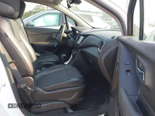 2020 Chevrolet Trax LT with VIN KL7CJLSBXLB073148, listed as a IAAI auction lot 40321540 with 53,972 mi miles and . Bid and sale history available at DreamBid. Image 5.