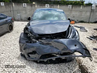 2024 Tesla Model Y with VIN 7SAYGDED2RF040079, listed as a Copart auction lot 57237054 with 2,549 mi miles and Non Repairable. Bid and sale history available at DreamBid. Image 5.