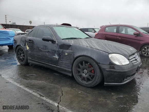 1999 Mercedes-Benz SLK-Class with VIN WDBKK47F9XF093465, listed as a Copart auction lot 45120525 with 148,641 mi miles and Salvage Title. Bid and sale history available at carsss.com. Image 4.