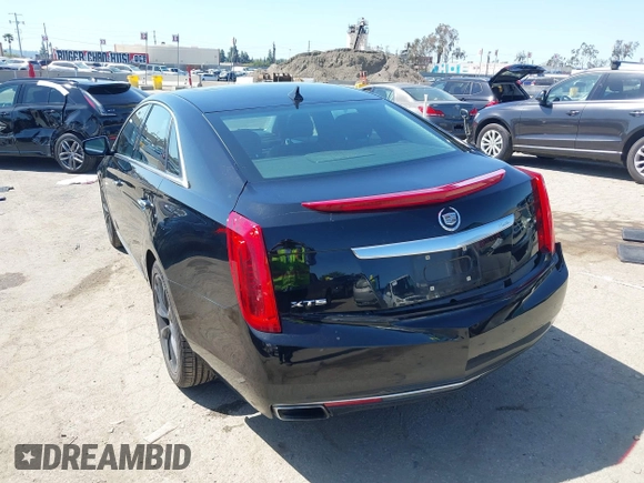 2013 Cadillac XTS Luxury z VIN 2G61P5S30D9220113, wystawiony jako IAAI lot #41970214 z przebiegiem 52 476 mil mil oraz . Historia ofert i sprzedaży dostępna na DreamBid. Obrazek 3.