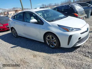 2021 Toyota Prius L Eco with VIN JTDKAMFUXM3142402, listed as a IAAI auction lot 41665484 with 67,416 mi miles. Bid and sale history available at carsss.com. Image 1.