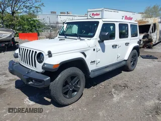 2021 Jeep Wrangler Unlimited Sahara z VIN 1C4HJXEN2MW528137, wystawiony jako IAAI lot #42134514 z przebiegiem 50 030 mil mil oraz . Historia ofert i sprzedaży dostępna na DreamBid. Obrazek 2.