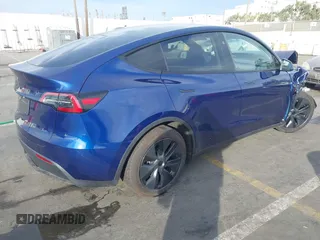 2025 Tesla Model Y Long Range with VIN 7SAYGDED2SF219423, listed as a IAAI auction lot 40984912 with 728 mi miles and . Bid and sale history available at DreamBid. Image 4.