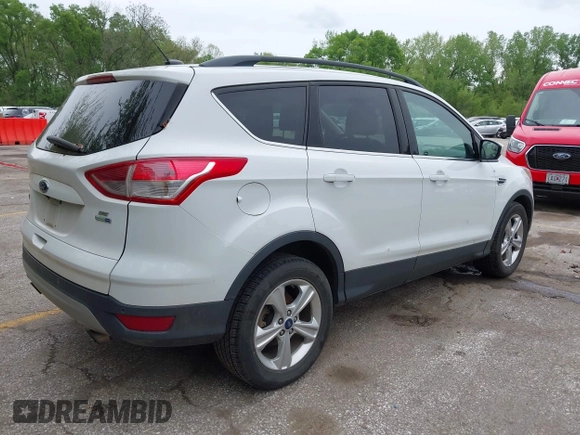 2016 Ford Escape SE with VIN 1FMCU9GX1GUC04085, listed as a IAAI auction lot 42126826 with 130,728 mi miles. Bid and sale history available at carsss.com. Image 4.