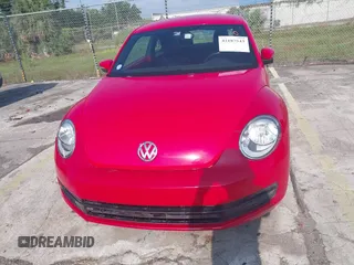 2013 Volkswagen Beetle 2.5L w/Sun/Sound/Nav with VIN 3VWJX7AT4DM672158, listed as a IAAI auction lot 42187543 with 94,961 mi miles and . Bid and sale history available at DreamBid. Image 12.