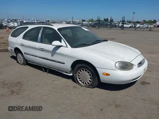 1996 Mercury Sable z VIN 1MELM55U0TG623025, wystawiony jako IAAI lot #42320328 z przebiegiem 235 325 mil mil oraz . Historia ofert i sprzedaży dostępna na DreamBid. Obrazek 1.