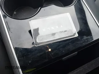 2019 Tesla Model 3 Mid Range with VIN 5YJ3E1EA5KF299589, listed as a IAAI auction lot 41709733 with 50,256 mi miles and . Bid and sale history available at DreamBid. Image 11.