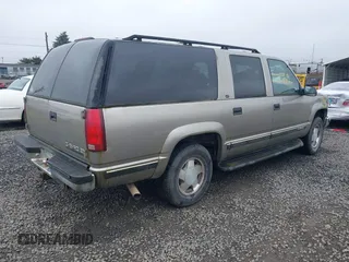 1999 Chevrolet Suburban z VIN 3GNFK16RXXG156463, wystawiony jako IAAI lot #41745169 z przebiegiem 165 541 mil mil oraz . Historia ofert i sprzedaży dostępna na DreamBid. Obrazek 4.