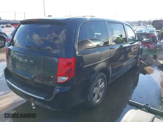 2014 Dodge Grand Caravan SXT with VIN 2C4RDGBG7ER197065, listed as a IAAI auction lot 41674441 with 233,065 mi miles. Bid and sale history available at carsss.com. Image 4.