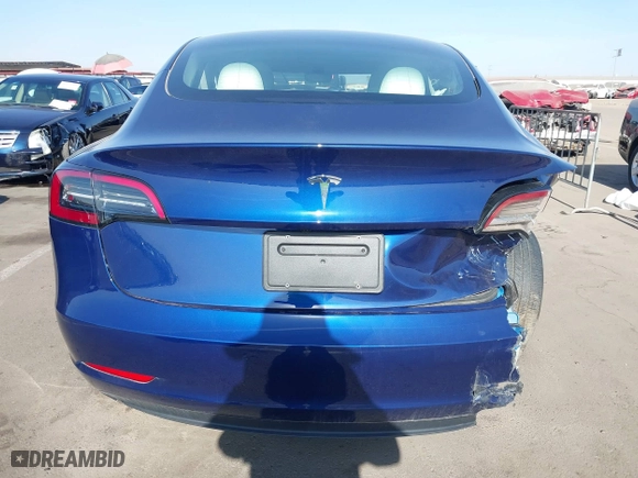 2023 Tesla Model 3 with VIN 5YJ3E1EA9PF697573, listed as a IAAI auction lot 41173833 with 6,966 mi miles. Bid and sale history available at carsss.com. Image 16.