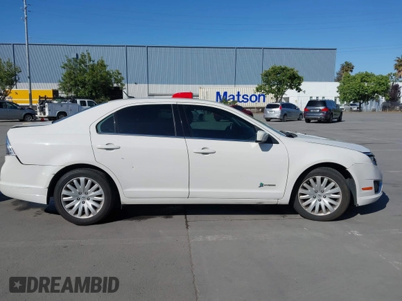 2012 Ford Fusion Hybrid z VIN 3FADP0L3XCR276182, wystawiony jako IAAI lot #42260450 z przebiegiem 133 567 mil mil oraz . Historia ofert i sprzedaży dostępna na DreamBid. Obrazek 13.