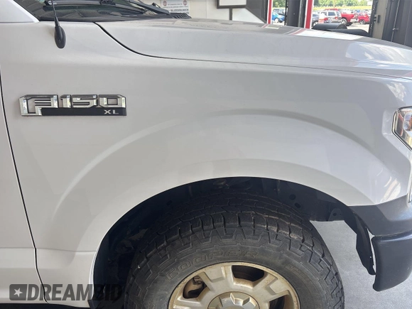 2019 Ford F-150 XL with VIN 1FTMF1EB1KKE10510, listed as a IAAI auction lot 42726982 with 98,336 mi miles and . Bid and sale history available at DreamBid. Image 23.