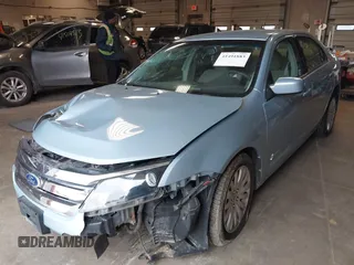 2010 Ford Fusion Hybrid z VIN 3FADP0L34AR276532, wystawiony jako IAAI lot #41491883 z przebiegiem 159 076 mil mil oraz . Historia ofert i sprzedaży dostępna na DreamBid. Obrazek 2.