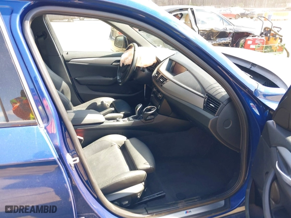 2015 BMW X1 sDrive28i with VIN WBAVM1C58FV314947, listed as a IAAI auction lot 41874472 with 128,271 mi miles. Bid and sale history available at carsss.com. Image 5.