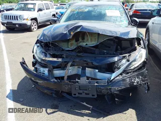 2018 Honda Civic LX with VIN 2HGFC2F54JH548274, listed as a IAAI auction lot 41864457 with 60,905 mi miles and . Bid and sale history available at DreamBid. Image 12.