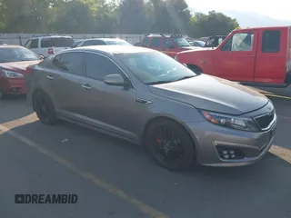 2015 Kia Optima SX Turbo with VIN 5XXGR4A61FG395148, listed as a IAAI auction lot 40313811 with 104,978 mi miles and . Bid and sale history available at DreamBid. Image 1.