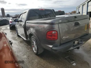 2002 Ford F-150 Harley Davidson with VIN 1FTRW07352KD72978, listed as a Copart auction lot 85037204 with 53,951 mi miles and Salvage Title. Bid and sale history available at carsss.com. Image 2.