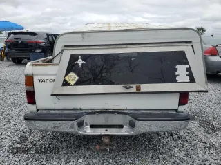 1999 Toyota Tacoma z VIN 4TAVL52N8XZ435689, wystawiony jako Copart lot #52162105 z przebiegiem 2 317 301 mil mil oraz Szkoda całkowita • Salvage title. Historia ofert i sprzedaży dostępna na DreamBid. Obrazek 6.