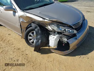 2006 Toyota Camry STD z VIN 4T1BE30K06U126692, wystawiony jako IAAI lot #42335766 z przebiegiem 74 000 mil mil oraz . Historia ofert i sprzedaży dostępna na DreamBid. Obrazek 12.