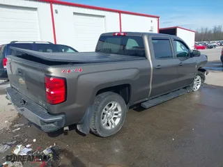 2014 Chevrolet Silverado 1500 LT with VIN 3GCUKREC0EG187214, listed as a IAAI auction lot 41490238 with 145,852 mi miles. Bid and sale history available at carsss.com. Image 4.