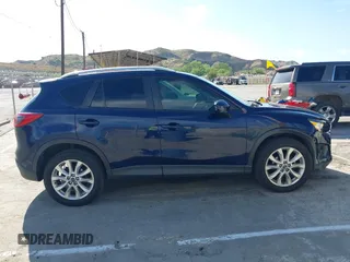2014 Mazda CX-5 Grand Touring with VIN JM3KE2DY7E0376389, listed as a IAAI auction lot 42014946 with 126,081 mi miles. Bid and sale history available at carsss.com. Image 13.