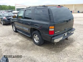 2004 Chevrolet Tahoe LT with VIN 1GNEC13Z14R203713, listed as a IAAI auction lot 42490743 with 216,529 mi miles and . Bid and sale history available at DreamBid. Image 3.