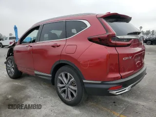 2021 Honda CR-V Touring z VIN 7FART6H96ME037070, wystawiony jako Copart lot #60664755 z przebiegiem 35 694 mil mil oraz Szkoda całkowita • Salvage title. Historia ofert i sprzedaży dostępna na DreamBid. Obrazek 2.