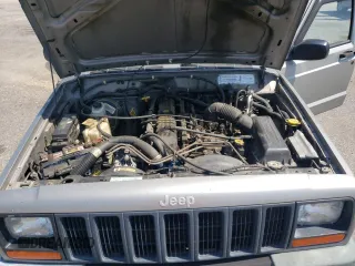 2000 Jeep Cherokee with VIN 1J4FN28S6YL210944, listed as a Copart auction lot 65163475 with 147,609 mi miles and Salvage title. Bid and sale history available at DreamBid. Image 12.