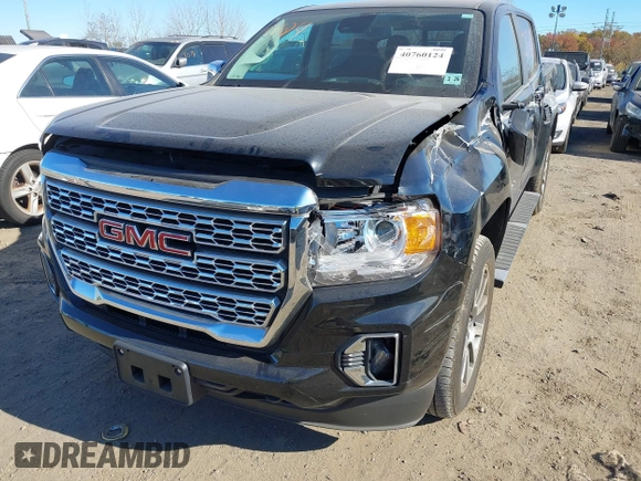 2021 GMC Canyon 4WD Denali z VIN 1GTG6EEN9M1240596, wystawiony jako IAAI lot #40760124 z przebiegiem 52 985 mil mil oraz . Historia ofert i sprzedaży dostępna na DreamBid. Obrazek 6.