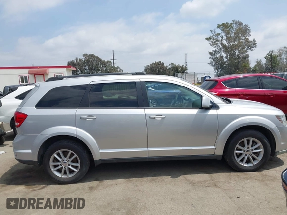 2013 Dodge Journey SXT with VIN 3C4PDCBG9DT506384, listed as a IAAI auction lot 42119685 with 143,769 mi miles. Bid and sale history available at carsss.com. Image 14.