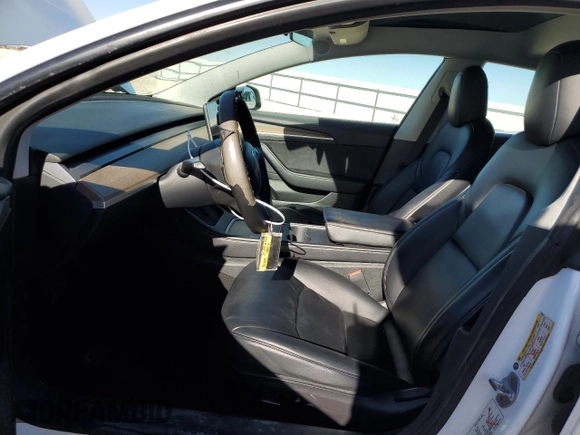 2021 Tesla Model 3 Standard Range Plus with VIN 5YJ3E1EA7MF089997, listed as a Copart auction lot 81528284 with 147,242 mi miles and Clean Title. Bid and sale history available at DreamBid. Image 7.