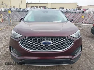 2024 Ford Edge SEL z VIN 2FMPK4J94RBA23897, wystawiony jako IAAI lot #41810930 z przebiegiem 7 110 mil mil oraz . Historia ofert i sprzedaży dostępna na DreamBid. Obrazek 12.