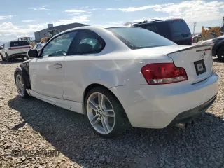 2012 BMW 1 Series 135i with VIN WBAUC9C52CVM12915, listed as a Copart auction lot 67145834 with 114,306 mi miles and Salvage title. Bid and sale history available at DreamBid. Image 2.