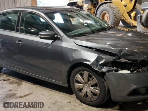2012 Volkswagen Jetta SE with VIN 3VWDX7AJ1CM344402, listed as a Copart auction lot 69927324 with 173,569 mi miles and Salvage title. Bid and sale history available at DreamBid. Image 4.