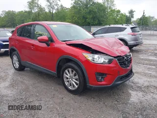 2016 Mazda CX-5 Touring z VIN JM3KE2CY1G0911365, wystawiony jako IAAI lot #42314557 z przebiegiem 101 000 mil mil oraz . Historia ofert i sprzedaży dostępna na DreamBid. Obrazek 1.
