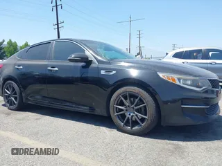 2016 Kia Optima LX z VIN 5XXGT4L3XGG008098, wystawiony jako IAAI lot #42355830 z przebiegiem 203 517 mil mil oraz . Historia ofert i sprzedaży dostępna na DreamBid. Obrazek 1.