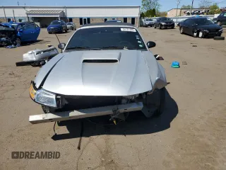 1999 Ford Mustang with VIN 1FAFP4448XF233101, listed as a Copart auction lot 54701005 with 54,585 mi miles and Salvage title. Bid and sale history available at DreamBid. Image 5.