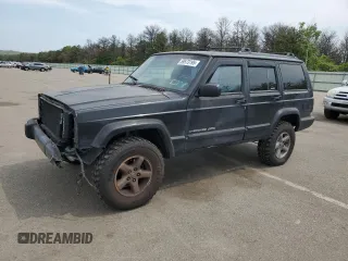 1999 Jeep Cherokee Sport z VIN 1J4FF68S9XL635836, wystawiony jako Copart lot #59573195 z przebiegiem 187 035 mil mil oraz Szkoda całkowita • Salvage title. Historia ofert i sprzedaży dostępna na DreamBid. Obrazek 1.